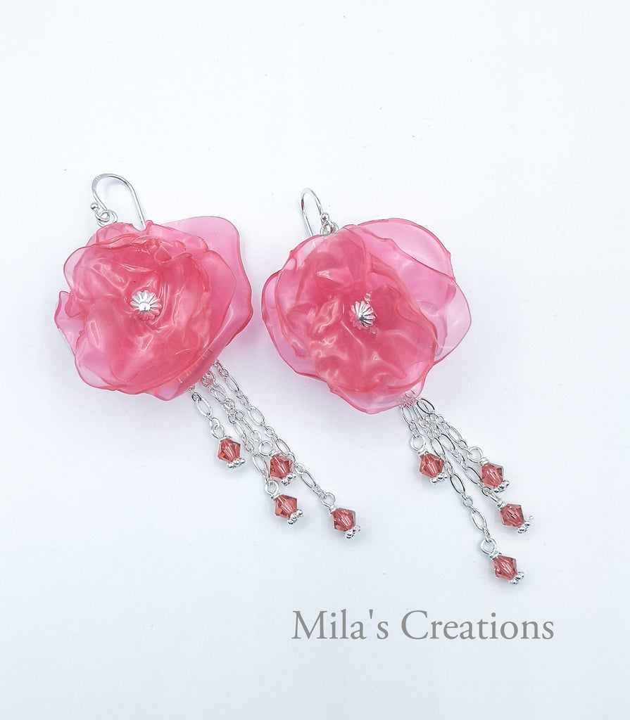 A pair of beautiful handmade earrings, crafted with plastic cups, accentuated with silver chain and gleaming tiny crystal drops.