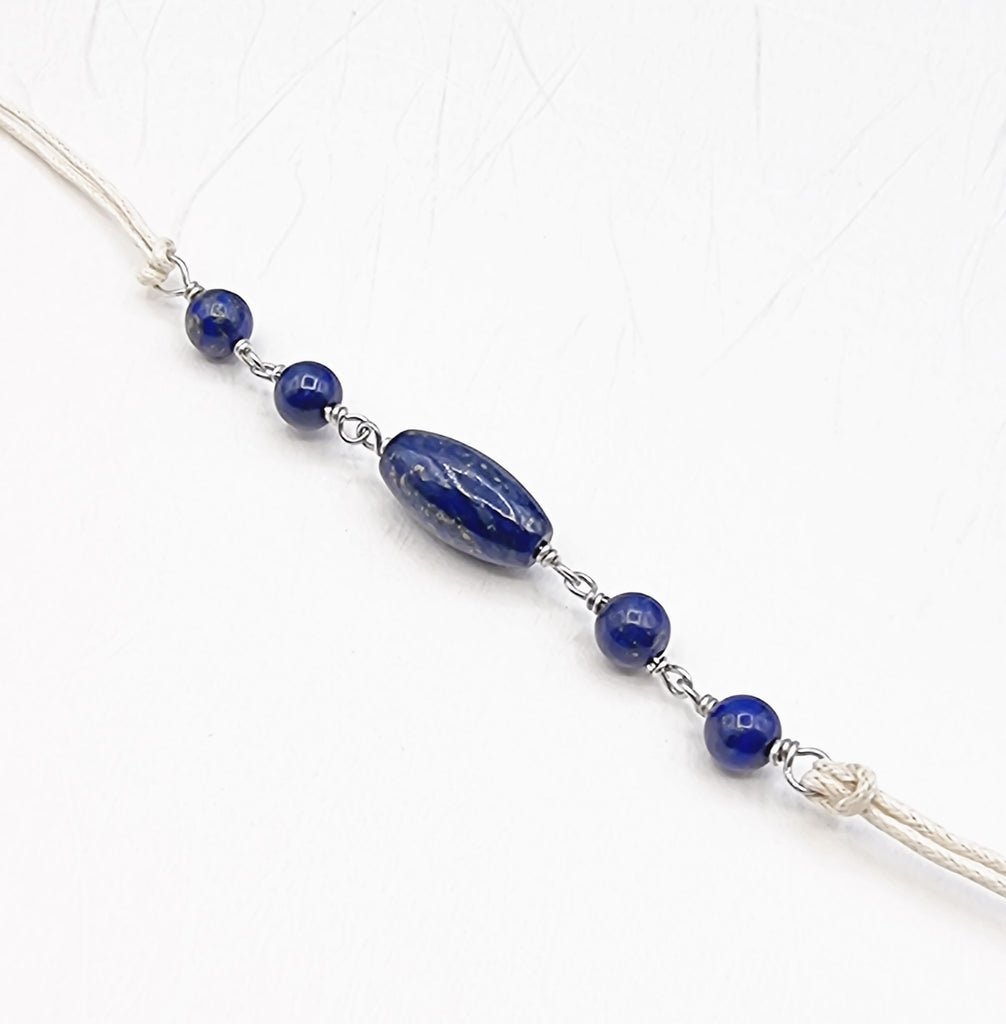 A handmade Rakhi delicately crafted with gorgeous natural Lapis Lazuli gemstones, that has been prized for its beauty and metaphysical properties for centuries. Truly unique and one-of-a-kind!